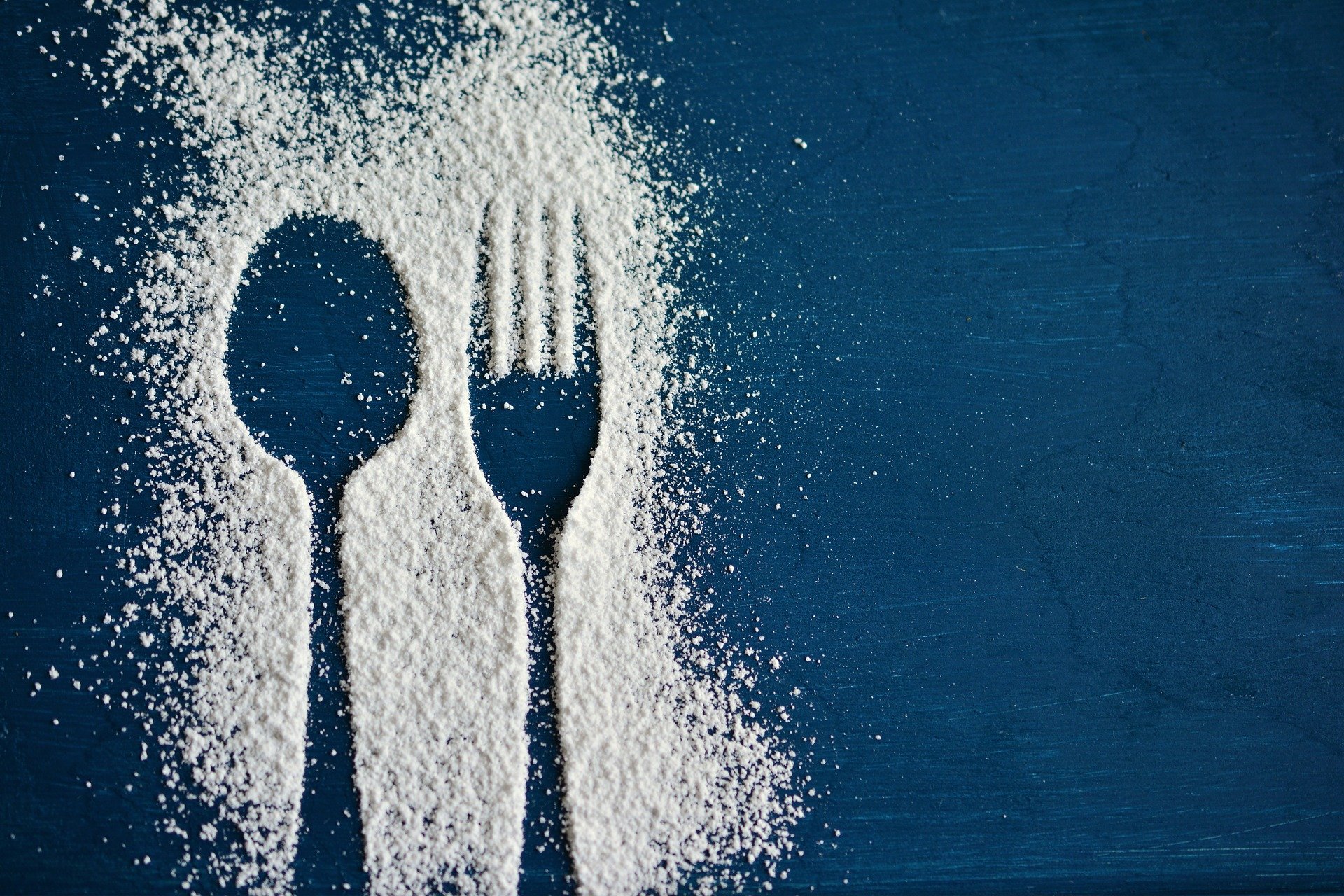 Picture of spoon and fork in sugar